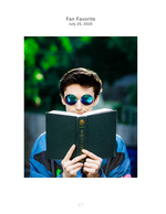 man reading behind a book portrait photography