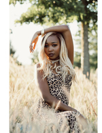 woman in leopard print dress in golden field fashion photography