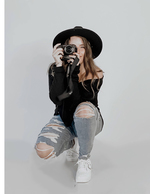 woman crouching with camera self-portrait photography