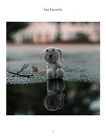 crocheted bunny toy reflected in puddle still life photography