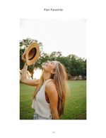woman laughing holding sun hat portrait photography