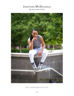 person perched on urban ledge portrait photography