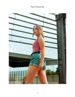 woman walking under glass canopy fashion photography