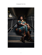 woman in printed dress seated on stairs portrait photography