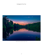 lake reflecting a colorful sunset through the trees landscape photography
