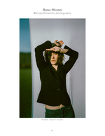 woman in black blazer backlit against a white backdrop portrait photography