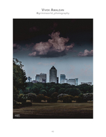 city skyline beneath dramatic storm clouds cityscape photography