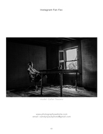 man seated at a desk in an abandoned room portrait photography
