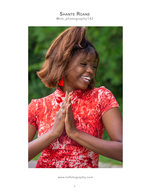 woman in red patterned dress with hands together portrait photography