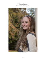 woman leaning against column in autumn woods senior portrait photography