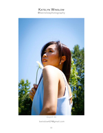 woman holding wildflower against blue sky portrait photography