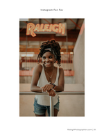 woman posing under Raleigh neon sign portrait photography