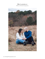 couple seated in autumn field engagement photography