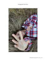 woman lying in tall grass portrait photography