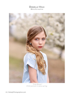 girl in blue dress under blossoming trees family photography