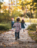 kids running down a leaf-covered path in autumn family photography