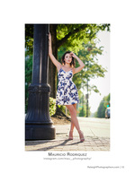 woman in floral dress posing by a lamppost street portrait photography