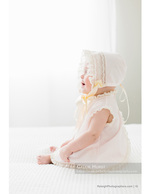 baby in a vintage lace bonnet newborn photography