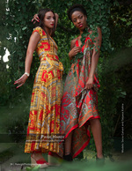 two models in bold patterned dresses among greenery fashion photography