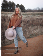 woman kicking up her leg on a dirt path portrait photography