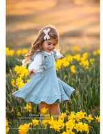 little girl twirling in a field of daffodils family photography