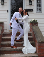 bride and groom with a champagne bottle on porch steps wedding photography