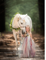 little girl with a flower-crowned unicorn horse family photography