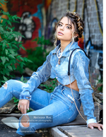 woman in denim sitting against a graffiti wall fashion photography
