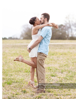 couple kissing in an open field portrait photography