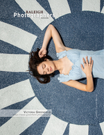 woman resting on a sunburst-patterned pavement back cover portrait photography