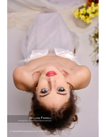 bride photographed upside-down among yellow flowers bridal photography