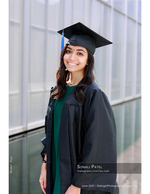 graduate in cap and gown smiling senior portrait photography