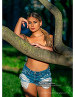 woman in leopard print top framed by a tree branch fashion photography