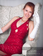 woman in a red sequin dress and white gloves portrait photography