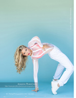 dancer arched backward in a white outfit fashion photography