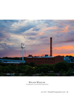 historic water tower and smokestack at sunset cityscape photography