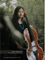 woman holding a cello in the woods portrait photography
