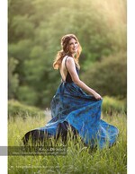 woman twirling in a blue floral gown portrait photography