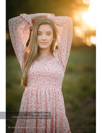 woman in a pink floral dress at golden hour portrait photography