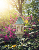 decorative birdhouse among blooming azaleas nature photography