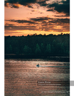 jet ski crossing a lake at sunset landscape photography