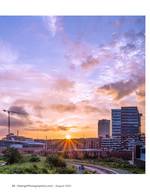 sunrise over the downtown skyline near the rail yard cityscape photography