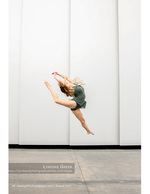 dancer captured mid-leap against a white wall dance photography