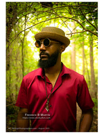 man in a straw hat and round sunglasses in the woods portrait photography