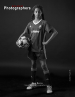 young soccer player posing with a ball back cover sports photography