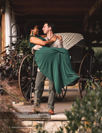 couple embracing beside a vintage carriage portrait photography