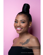 woman smiling against a pink studio backdrop portrait photography