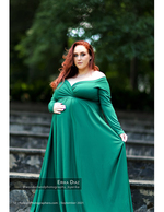 pregnant woman in an emerald gown on stone steps maternity photography