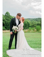 bride and groom kissing in an open field wedding photography