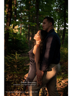 couple embracing in a sunlit forest portrait photography